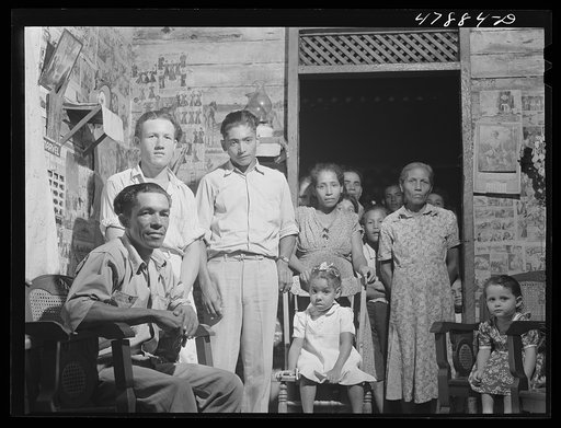 Guayanilla, Puerto Rico. Family of a sugar worker living in one of the company houses behind the mill. All these people live in the same houses