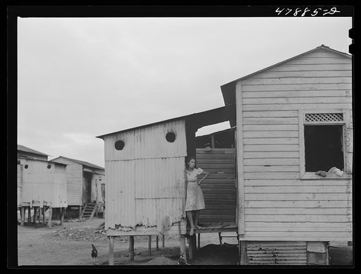 Guayanilla, Puerto Rico. Houses in a company village behind a sugar mill