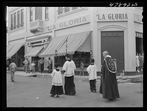 Yauco, Puerto Rico. A funeral procession on a street