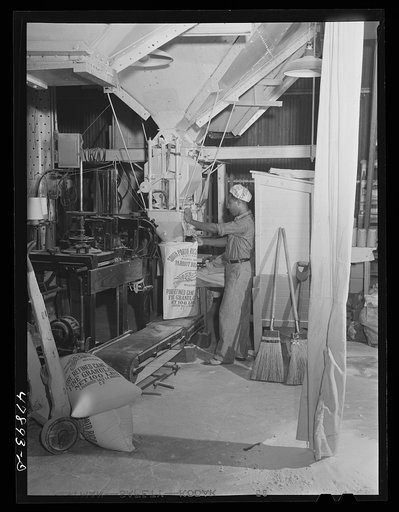Ensenada, Puerto Rico. Bagging refined sugar at the South Puerto Rico Sugar Company