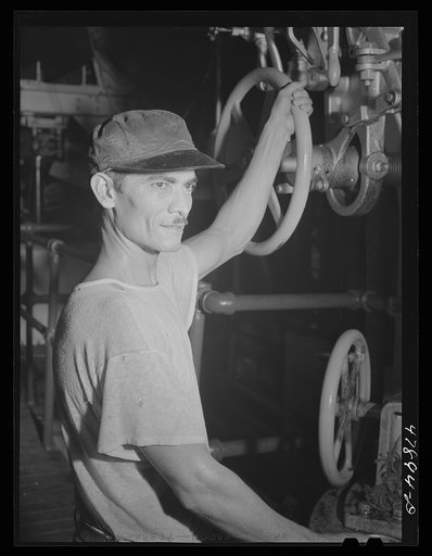 Ensenada, Puerto Rico. A workman in the mill of the South Puerto Rico Sugar Company