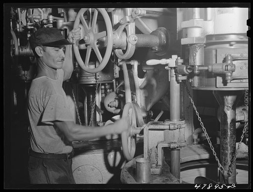 Untitled photo, possibly related to: Ensenada, Puerto Rico. A workman in the mill of the South Puerto Rico Sugar Company