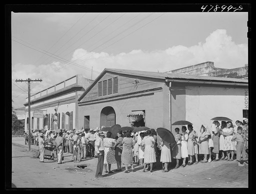 Cabo Rojo, Puerto Rico. Waiting in line to get surplus commodities. They were distributing fatback and meal