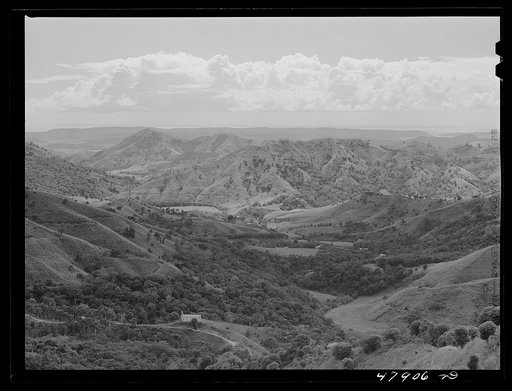 Guanica, Puerto Rico. Landscape of country looking south toward the town. The southwestern coast of Puerto Rico is in the background