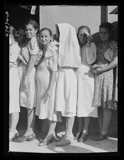 Untitled photo, possibly related to: Cabo Rojo, Puerto Rico. Waiting in line at the surplus commodities office. Fatback and meal were distributed that day