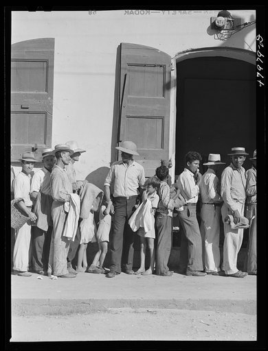 Untitled photo, possibly related to: Cabo Rojo, Puerto Rico. Waiting in line at the surplus commodities office. Fatback and meal were distributed that day