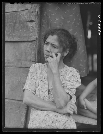 Utuado, Puerto Rico (vicinity). Farm laborer's wife who was being interviewed for eligibility in FSA (Farm Security Administration)'s farm labor program