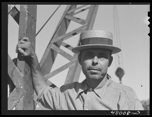 San Sebastian, Puerto Rico (vicinity). President of a FSA (Farm Security Administration) crane cooperative. There are thirteen members collectively using this crane for loading their sugar cane
