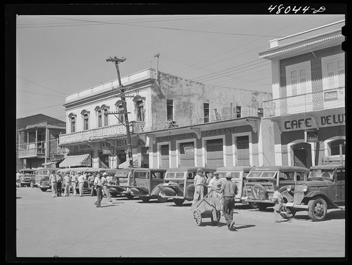 Arecibo, Puerto Rico. A row of station wagons or "publicos" waiting for loads and passengers