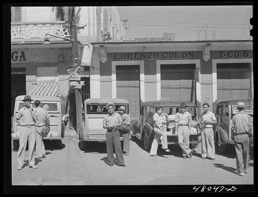 Arecibo, Puerto Rico. A row of station wagons or "publicos" waiting for loads and passengers