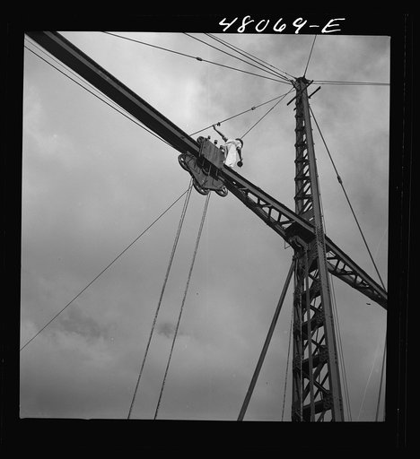 Untitled photo, possibly related to: San Sebastian, Puerto Rico (vicinity). Workman repairing a crane at a "central"