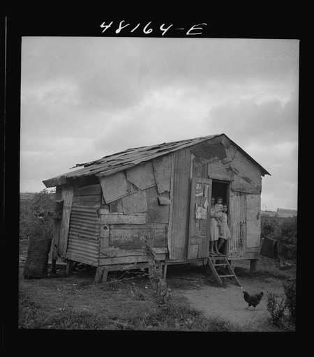 Santurce, Puerto Rico (vicinity). A house on the property which FSA (Farm Security Administration) is buying for a land and utility housing project