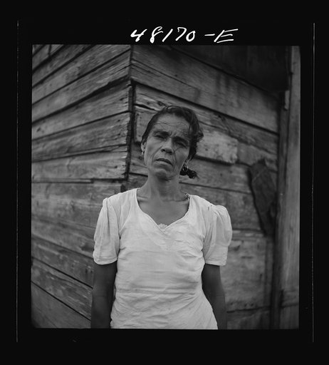 Untitled photo, possibly related to: Santurce, Puerto Rico (vicinity). Woman who lives in a house on the land which FSA (Farm Security Administration) is buying for a land and utility housing project