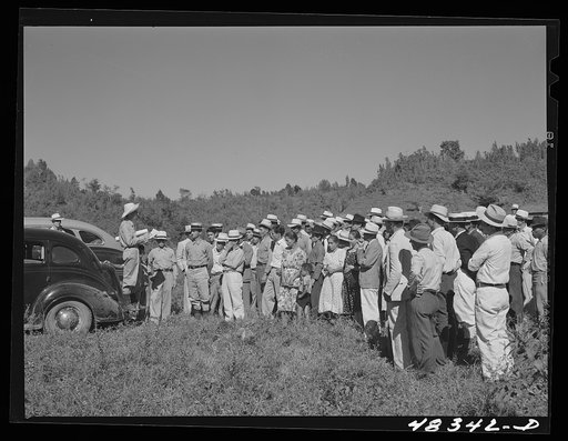 Untitled photo, possibly related to: Manati (vicinity), Puerto Rico. FSA (Farm Security Administration) borrowers and their families at a meeting held to discuss the distribution of land for tenant purchase farms