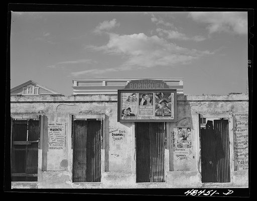 Untitled photo, possibly related to: San Sebastian, Puerto Rico. Advertisements for movies on an old building