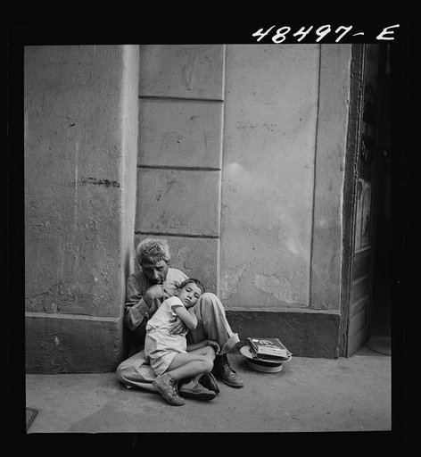 San Juan, Puerto Rico. Beggar and child on a street