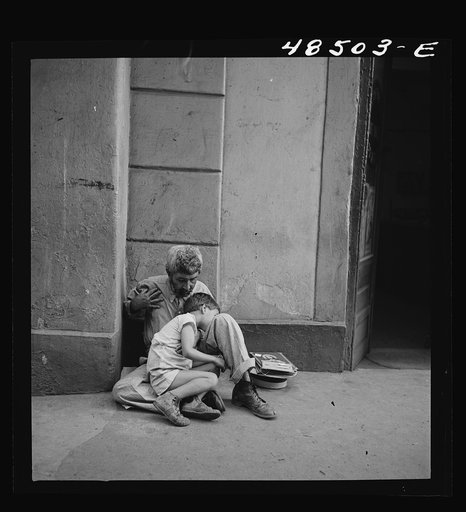 San Juan, Puerto Rico. Beggar and child on a street