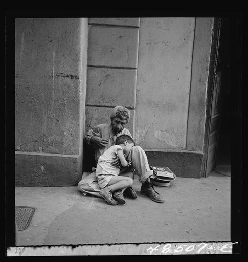 San Juan, Puerto Rico. Beggar and child on street