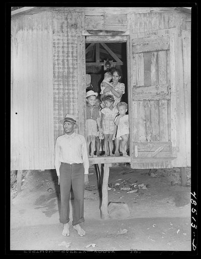 Untitled photo, possibly related to: Yabucoa, Puerto Rico. Striking sugar cane worker and his family