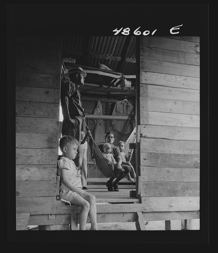Untitled possibly related to: Caguas, Puerto Rico (vicinity). A borrower and his family