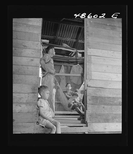 Untitled possibly related to: Caguas, Puerto Rico (vicinity). A borrower and his family