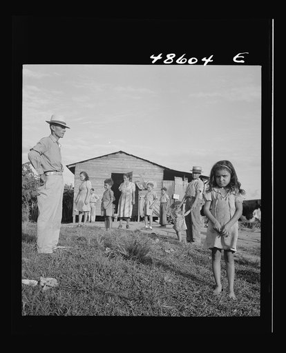Caguas, Puerto Rico (vicinity). A borrower and his family