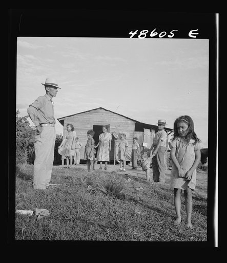 Untitled photo, possibly related to: Caguas, Puerto Rico (vicinity). A borrower and his family