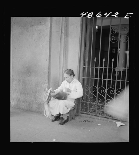 Untitled photo, possibly related to: San Juan, Puerto Rico. Selling lottery tickets on the street