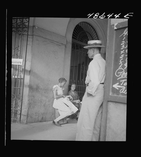 Untitled photo, possibly related to: San Juan, Puerto Rico. Selling lottery tickets on the street