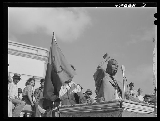 Untitled photo, possibly related to: Yabucoa, Puerto Rico. Union leader speaking to strikers at a meeting in the plaza