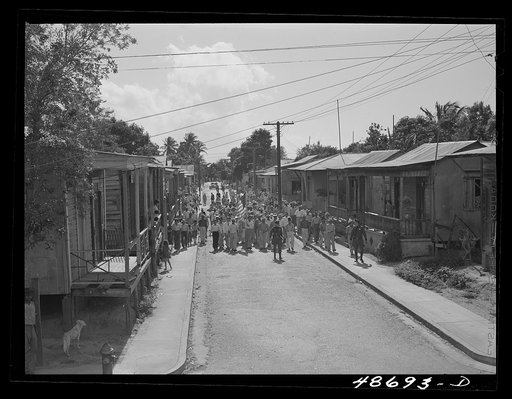 Yabucoa, Puerto Rico (vicinity). Procession of sugar strikers through a small town