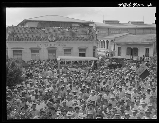 Untitled photo, possibly related to: Yabucoa, Puerto Rico (vicinity). Procession of sugar strikers through a small town