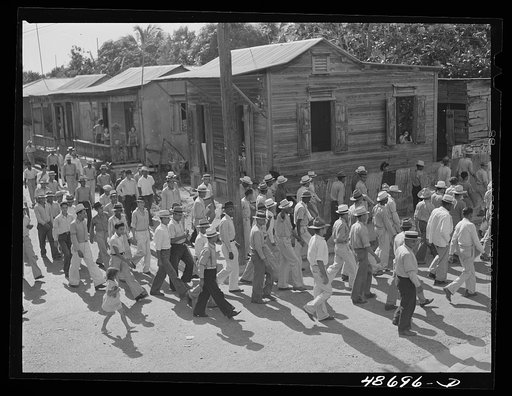 Yabucoa, Puerto Rico (vicinity). Procession of sugar strikers through a small town