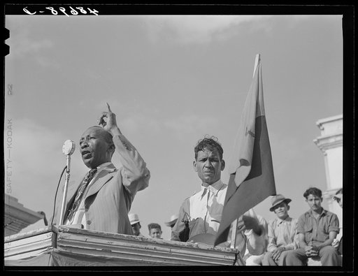Yabucoa, Puerto Rico. Union leader speaking to strikers at a meeting in the plaza