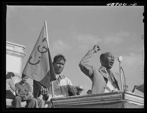 Untitled photo, possibly related to: Yabucoa, Puerto Rico. Union leader speaking to strikers at a meeting in the plaza