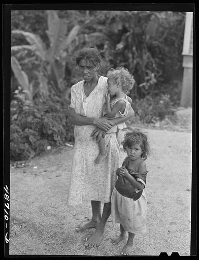 Untitled photo, possibly related to: Yabucoa, Puerto Rico (vicinity). Wife and some of the children of a farm laborer