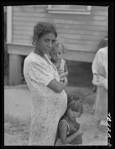 Untitled photo, possibly related to: Yabucoa, Puerto Rico (vicinity). Wife and some of the children of a farm laborer