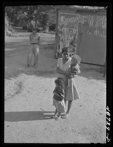 Untitled photo, possibly related to: Yabucoa, Puerto Rico (vicinity). Wife and some of the children of a farm laborer