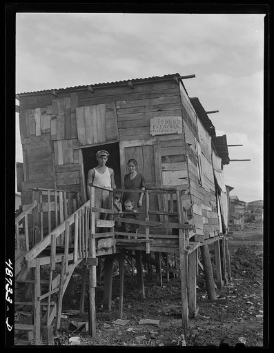 San Juan, Puerto Rico. El Fangitto, the slum area. The sign says the home is for sale