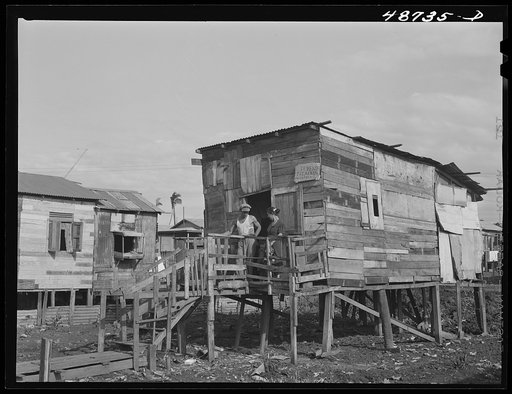 Untitled photo, possibly related to: San Juan, Puerto Rico. El Fangitto, the slum area. The sign says the home is for sale