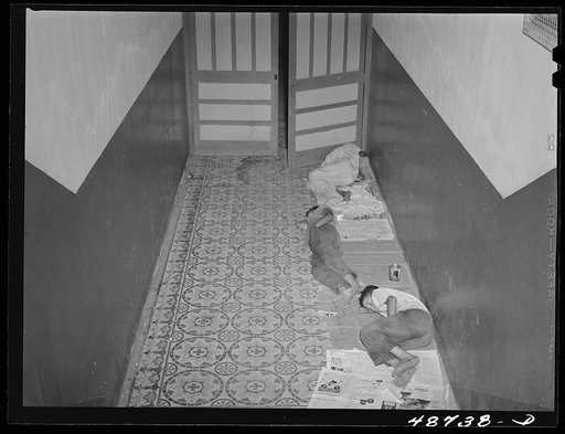 Untitled photo, possibly related to: Caguas, Puerto Rico. Homeless people sleeping in the hallway of an apartment house