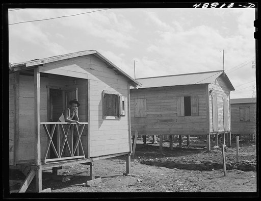 Untitled photo, possibly related to: San Juan, Puerto Rico. Worker from the naval base in San Juan who lives in this house in El Fangitto, the slum area
