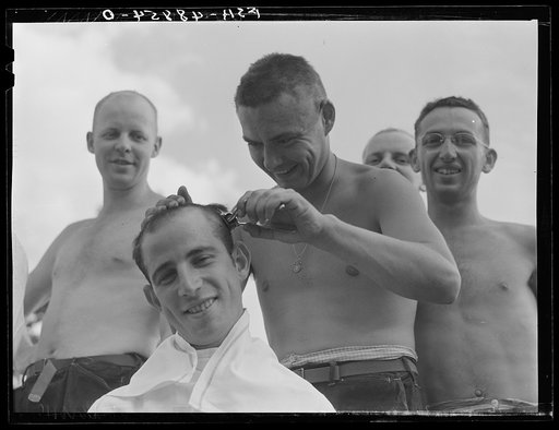 Camp Shelby, Hattiesburg, Mississippi. Getting a haircut