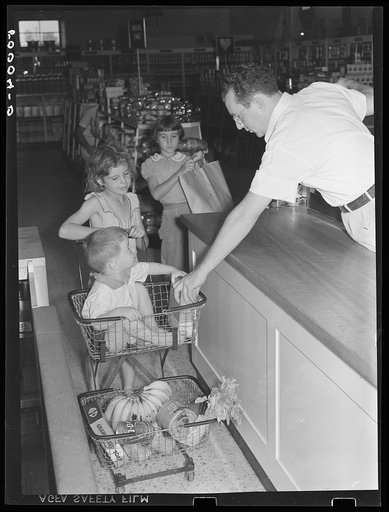 Children of Greenbelt, Maryland family buying groceries in cooperative store