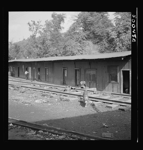 Coal miners' shacks along railroad tracks, center of mining town. Osage, West Virginia. (see 30247-M1 and 30236-M2)