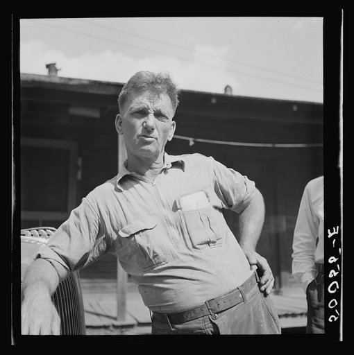 Coal miner, now unemployed, town philosopher, experiments with garden. Says "Jes so long as I sees things movin' and betterin' I don't care how much benefits I git from it." Jere, West Virginia. See 50057-E, 30219-M3