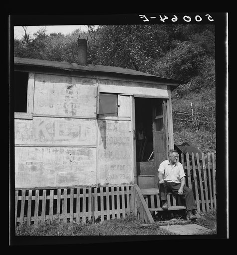 Untitled photo, possibly related to: Unemployed miner's home he built. "It'll be purtier when I paint it." Scott's Run, West Virginia. Osage, West Virginia