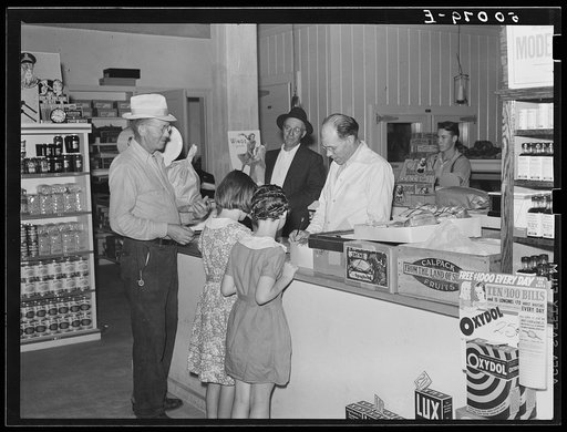 Buying groceries in community store. Tygart Valley, West Virginia