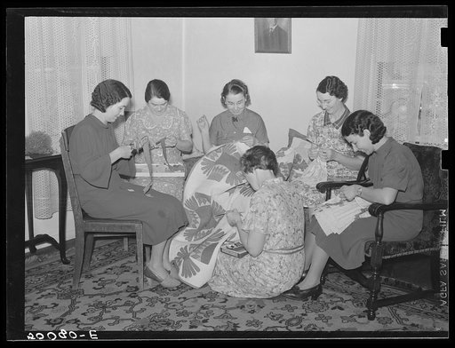 Untitled photo, possibly related to: Housewives in Tygart Valley, West Virginia, have weekly group meetings in home economics. Here they are quilting