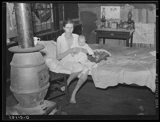 Untitled photo, possibly related to: Wife and two children of unemployed mine worker. She has TB and syphilis. They are one of five families living in old abandoned company store in abandoned mining community of Marine, West Virginia